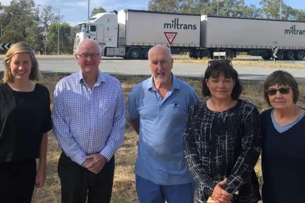 CROSSING CONCERNS: Steph Ryan (MLA, Euroa), Cr Malcolm Little, Avenel Action Group president Jeff Moran, mayor Amanda McLaren and Avenel Action Group member Helen Dawson are all calling on the State Government to take action to ensure safety at the freeway intersection.