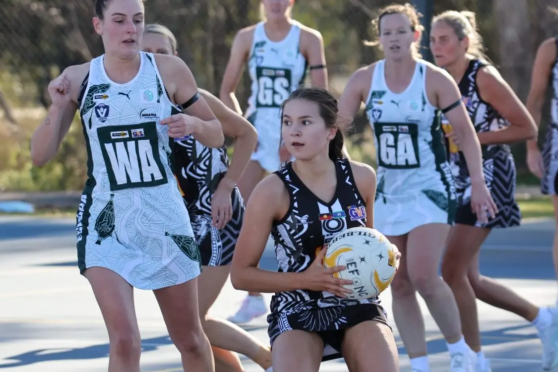 STANDING TALL: Despite being outnumbered, Ruby Watson controls the ball as she comes out of the back court. PHOTOS: Matthew Mills
