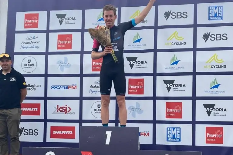 VICTORY: Dan Johnson enjoying accolades on the dais following his C grade win in the Melbourne to Warrnambool Cycling Classic.