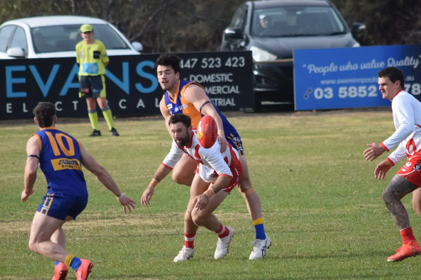 DAVID VS GOLIATH: Josh Delaney stands his ground against a towering opponent, refusing to go down. PHOTOS: ANDY WILSON