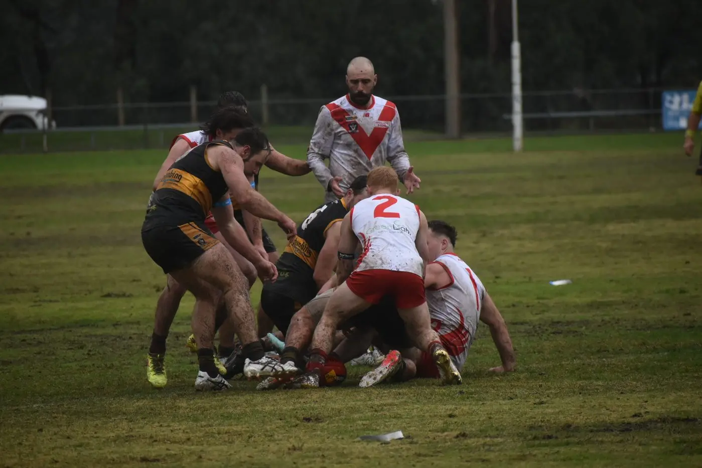 TIGERS AND SWANS SCRAP: Avenel runs out of legs against the Rushworth Tigers.