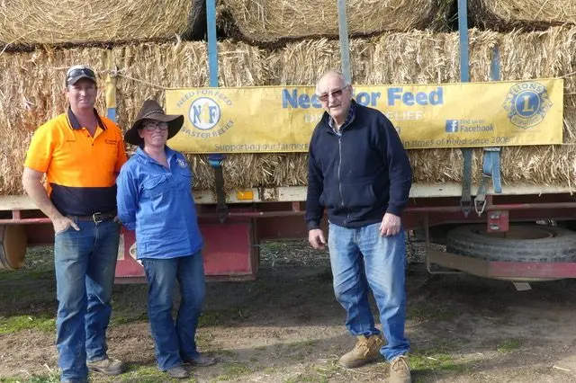 LOCAL CONTRIBUTION: John Sargood (right) with Nathan and Marie Wilson prior to departure with Euroa\\'s donation of hay. PHOTO: Alan Borden