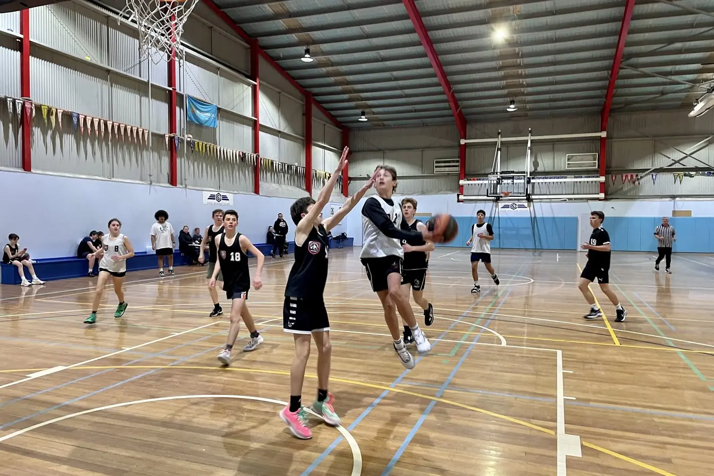 BOYS ARE BACK: Bryse Ashcroft drives to the basket against Ashton Morris in the under 18s game last Tuesday night.
