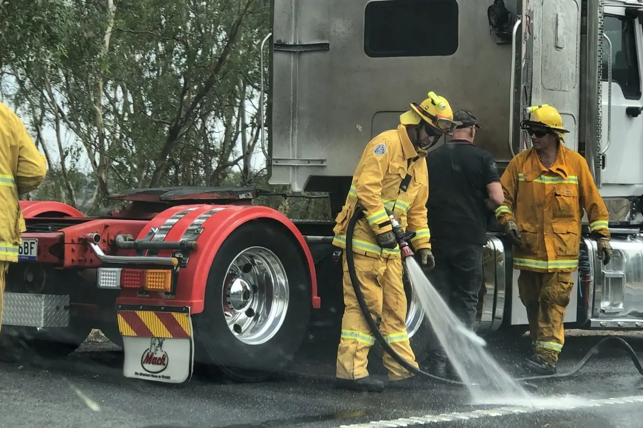 MOPPING UP: Fire crews from Baddaginnie and Benalla were quick to put out Thursday\\'s truck fire. PHOTOS: Andy Wilson\\n