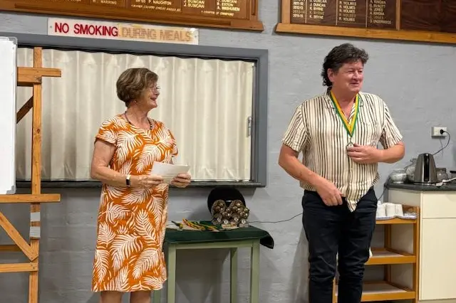 ONE HUNDRED UP WINNER: Leanne Russell-Jones presents Neil Higgins with the 100Up winner\\'s medallion.