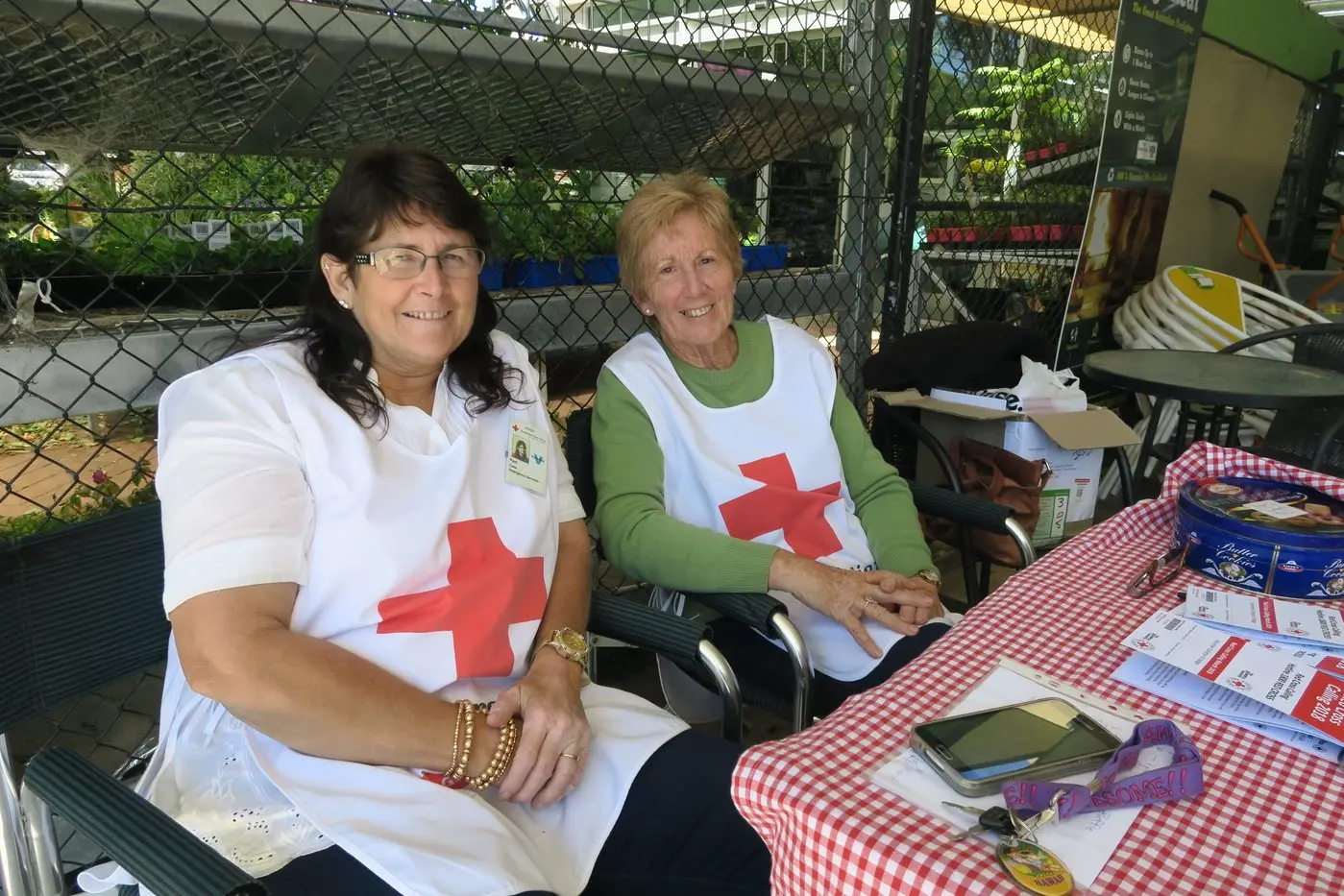 RED CROSS CALLING: Watch out for Red Cross members, such as Pam Case and Kristeen Boyce, who will be found outside Burtons during this annual event. PHOTO: Heather Bamford Id:21269
