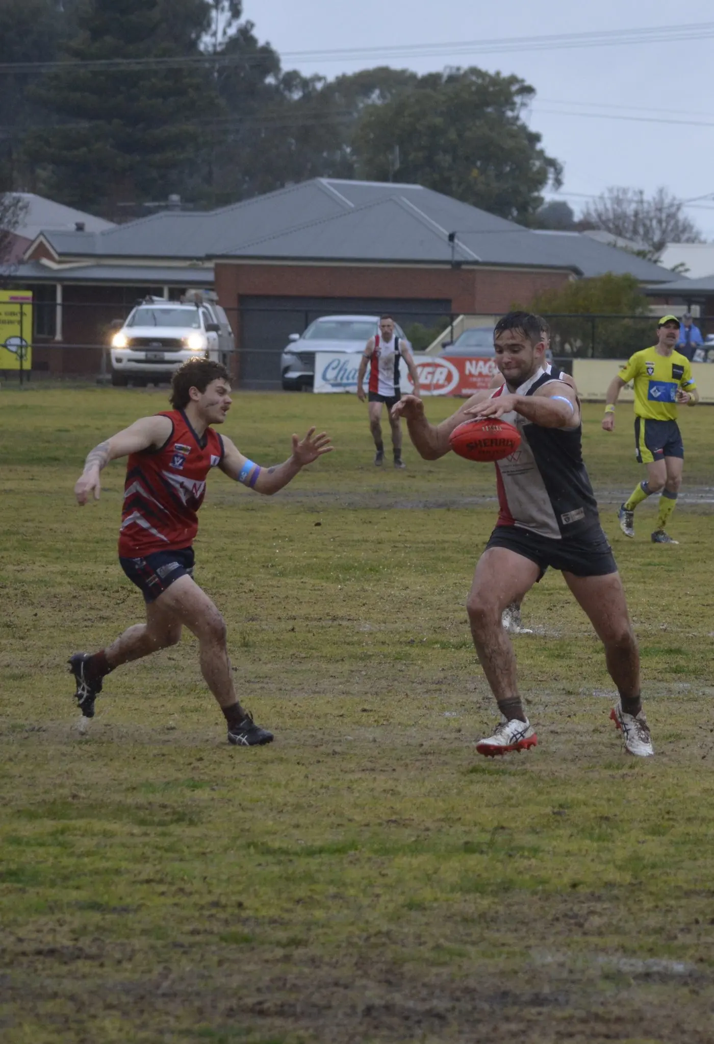 CLEARING KICK: Longwood\\'s George Chamouras attempts to charge down his Nagambie opponent. PHOTOS: Andy Wilson