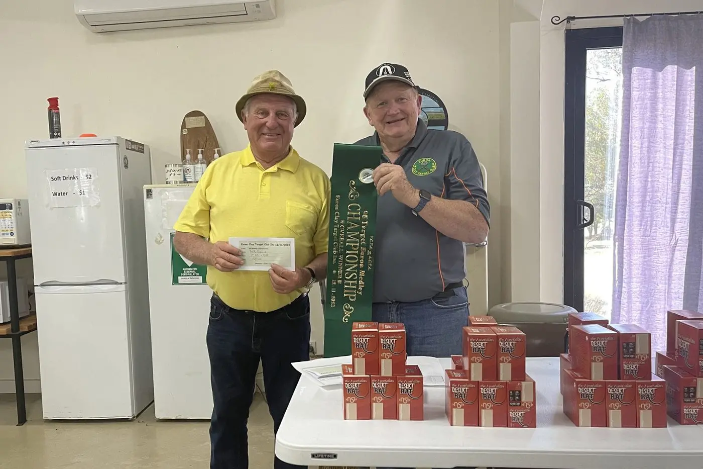 WINNING SHOOTER: Veteran Fred Heinze wins the Medley Champion with President Laurie.