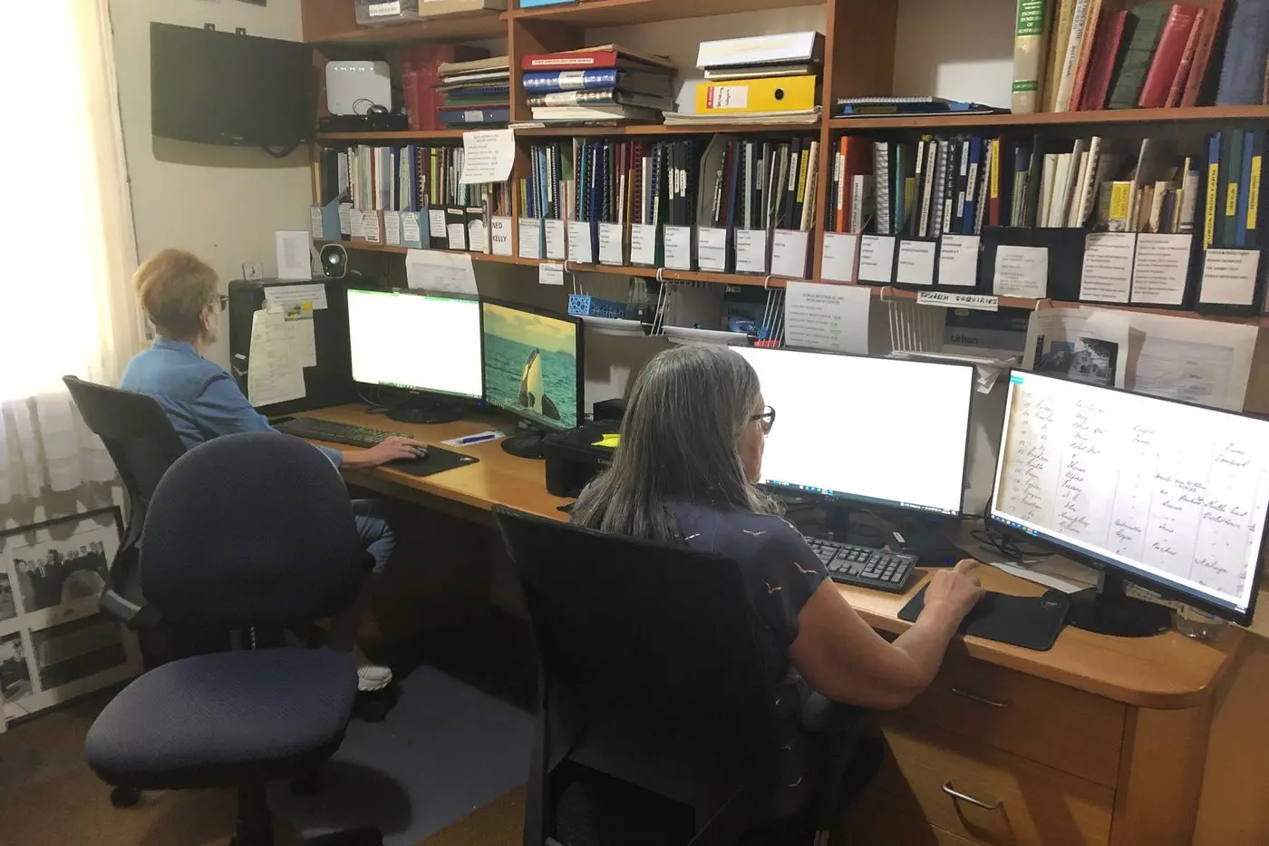 A VERY INVOLVED TASK: Lyn Brereton (left) and Rohs Harris spend many hours tagging photos and interpreting documents in readiness for access by family history researchers. PHOTOS: Heather Bamford Id:23097