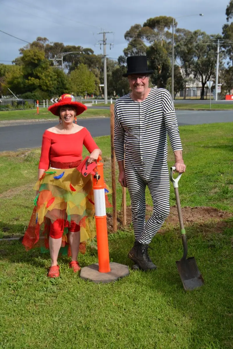 PLANTING FUN: A prize of a pack of toilet paper was on offer for the most flamboyant dressers at a street planting day.  This was won by Melanie Ball and Simon Ball, two Kennedy Street residents who love any excuse to dress-up. PHOTO: Charles Street