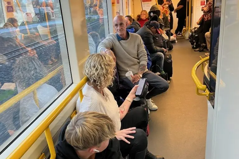 LONG TRIP: Passengers on an Albury line service on Monday were forced to sit on the floor or stand due to overcrowding.