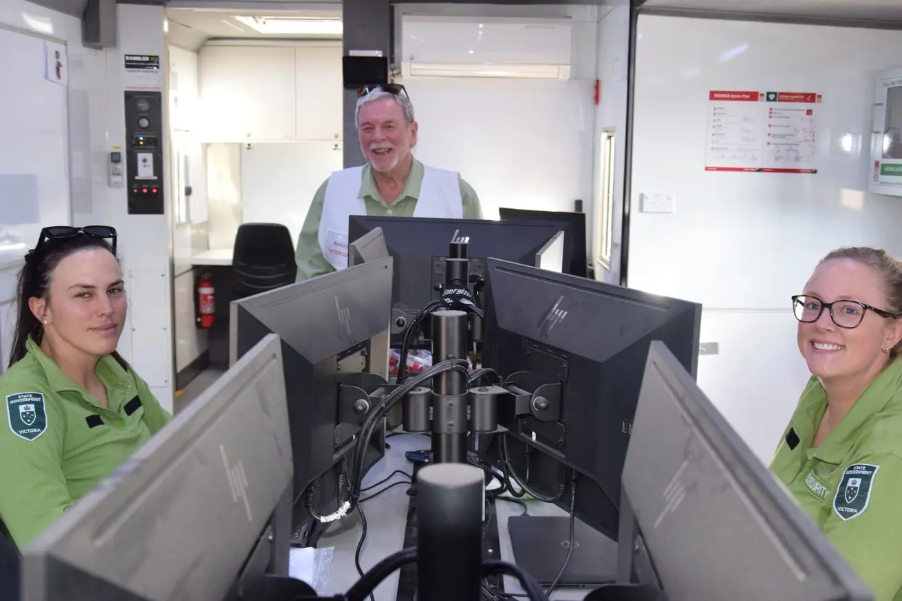 SHUTTING UP SHOP: Biosecurity officers and veterinarians Kate Rowe and Brigitte Pattinson closing down the mobile bird flu testing station with Mr Patterson looking forward to leaving town.