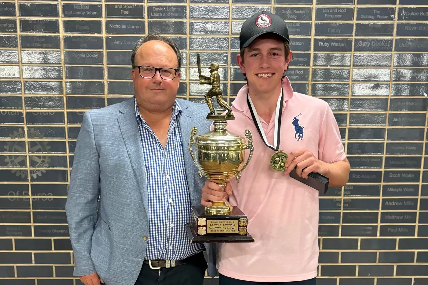 STELLAR SEASON: Club Legend Glen Coridas presents Walter Jackson with his cricket awards.
