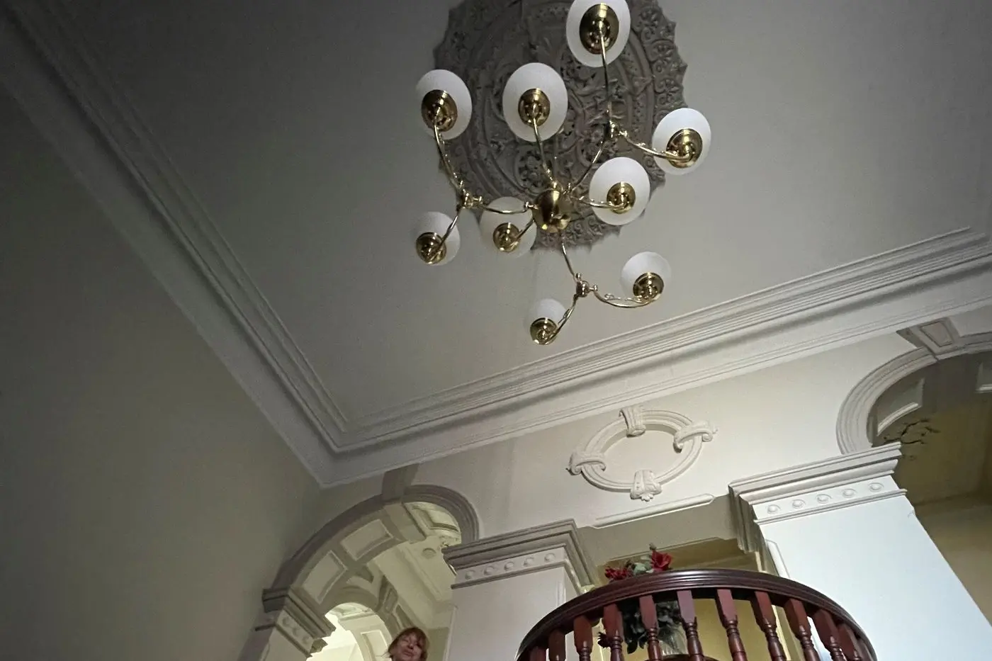 EERIE: Cat Ward standing in the staircase of the Euroa Hotel, once described as the grandest of its time. PHOTO: Clemence Carayol