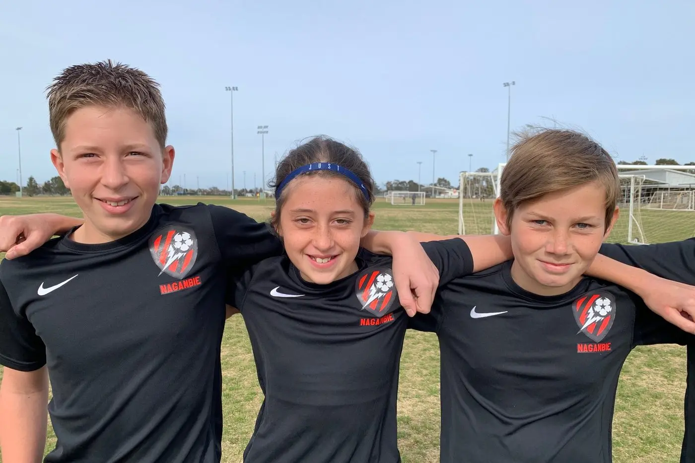 A NEW VENTURE: Proudly showing off their new soccer jerseys are Liam Tremble (left), Macey Watson and Micah Close.