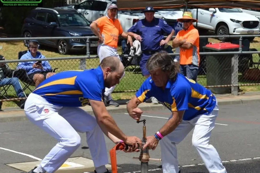 TEAMING UP: Gerard Williams prepares to turn the water on as Max Furlanetto connects to the hydrant. PHOTOS: K160 Photography