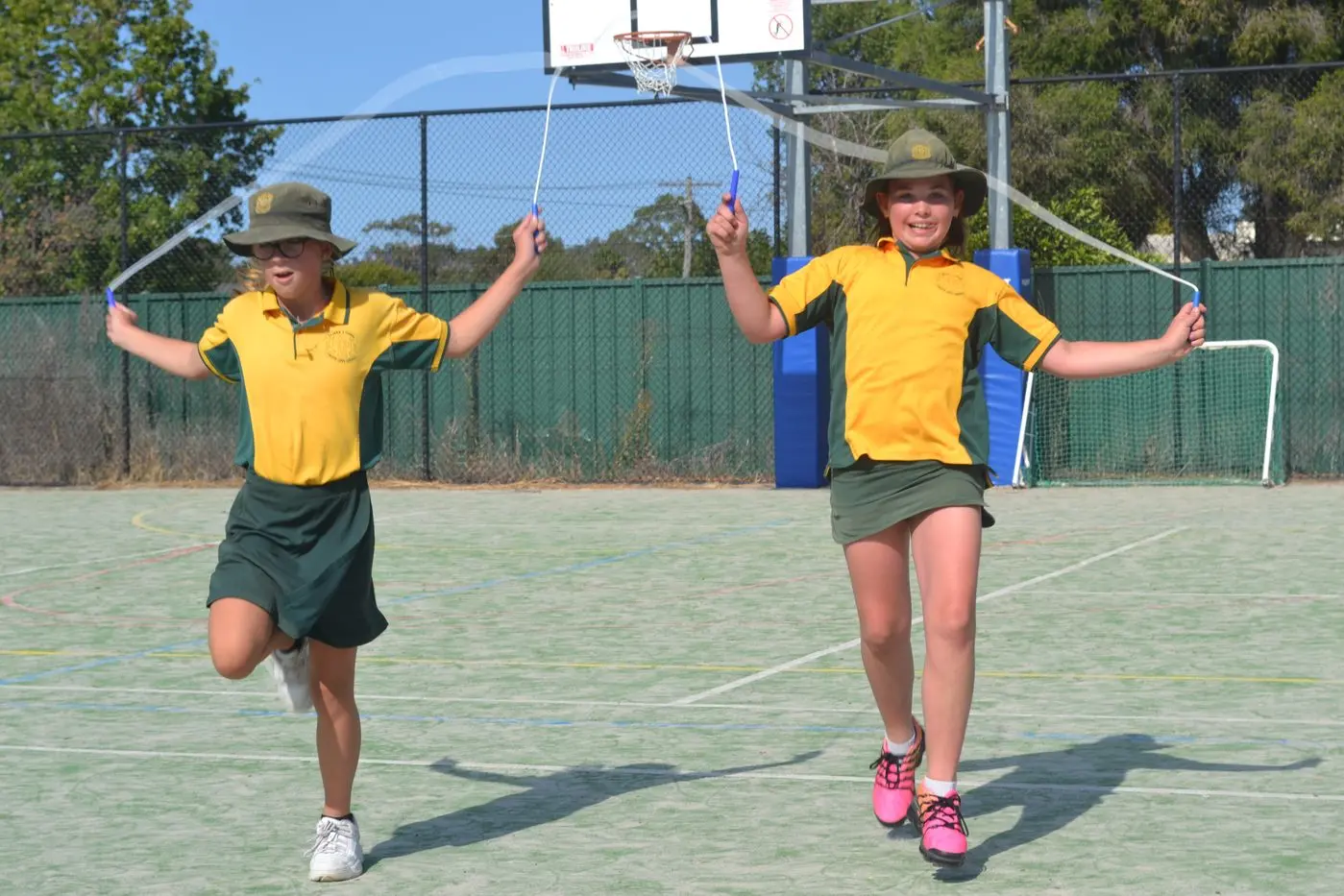 OBVIOUS ENJOYMENT: Shelby Baker (left) and Addison Pastuzska concentrate on their individual skipping.