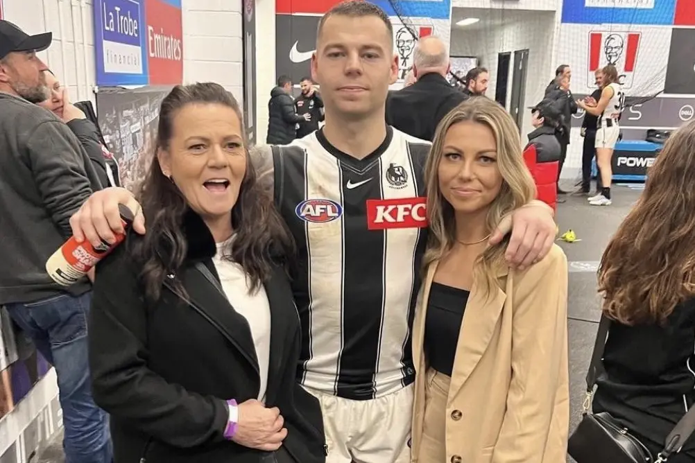 PROUD AS PUNCH: Fiona (Mum), Jamie and Caitlyn Elliott capture a moment before Jamie helps break Collingwood\\'s 13-year drought.