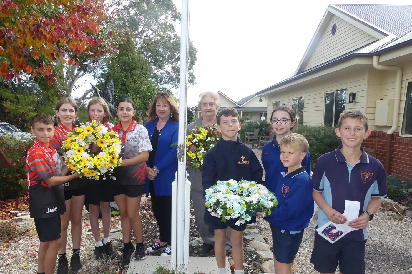 LEST WE FORGET: Young and old share ANZAC traditions.  Nagambie Healthcare ANZAC Day ceremony participants (from left) Nagambie Primary School students Jake Whittaker, Luci Fletcher, Archie Boyle, Emelia D\\u2019Andrea,  Bev Benson - Nagambie RSL vice president, Diane Grant -  ceremony celebrant, St Joseph\\u2019s Catholic Primary School students Hunter Roberts, Ivy Munday, Max Lambert, and Sebastian Garrett. PHOTO: Diane Grant