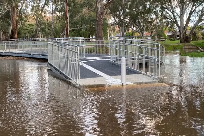 SOGGY FEET: The new Friendlies Bridge near Memorial Oval was nearly submerged on Friday evening as flood levels rose in Euroa\\'s Seven Creeks. PHOTO: Philippe Perez