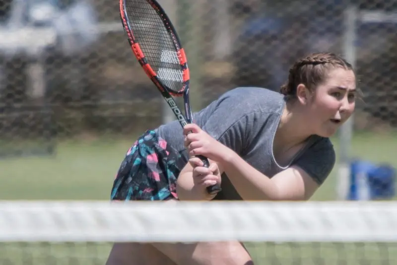 FACING TOUGH OPPOSITION: Kalarni Anderson worked determinedly on this return. PHOTO: Dale Mann