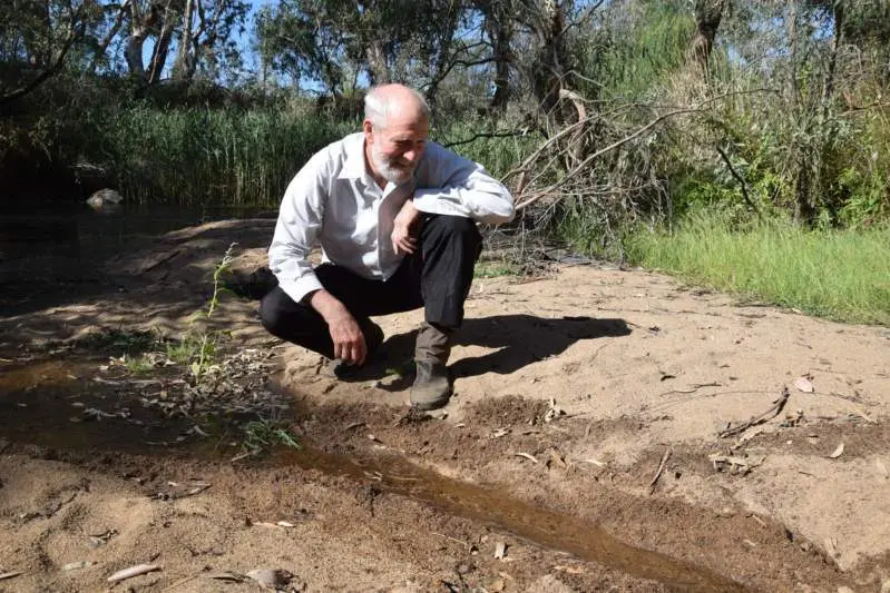 FLOWING DELIGHT: Retired habitat restorer Ray Thomas inspecting the first flow of water coming from the Strathbogie Ranges on Friday afternoon.