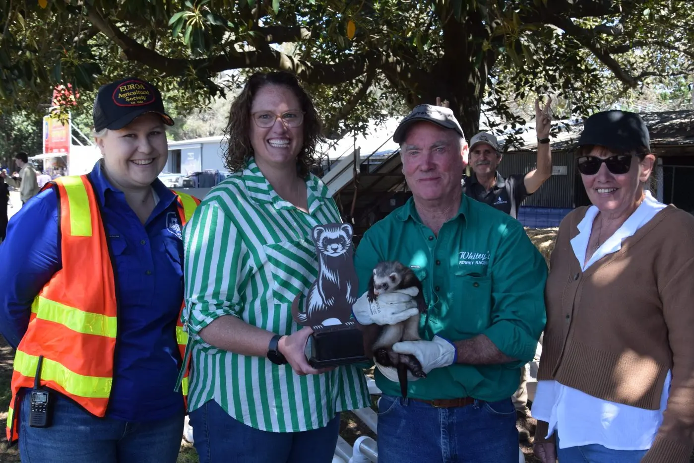 FERRET RACING CUP: Euroa Ag Society vice president Kate Harcourt, Choices Flooring by Thomsons owner Jacqui Thomson, Whiteys Ferret Racing owner Martin White, and Micki Morris, who accepted the trophy on behalf of Avenel Imperial Hotel. PHOTOS: Darren Chaitman