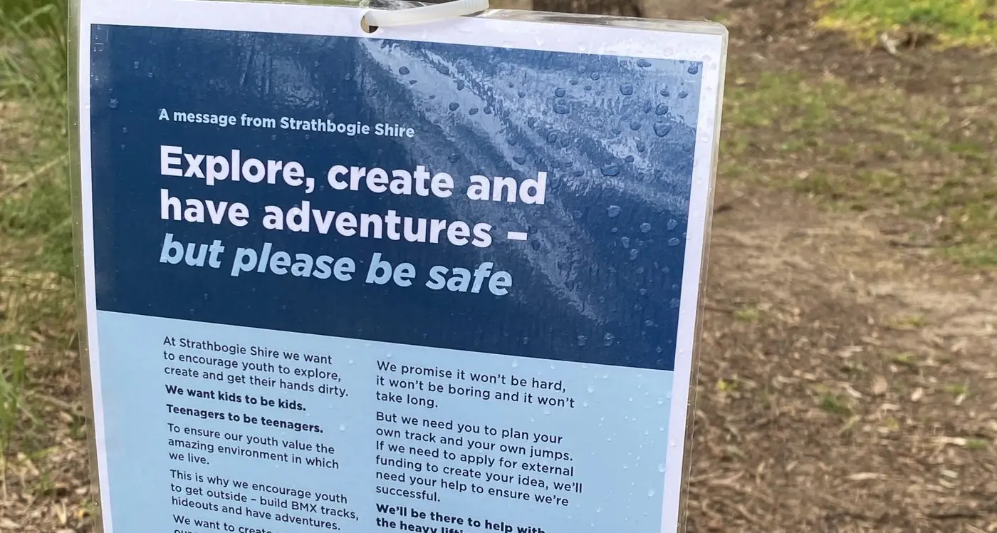 BMX track pedalling along