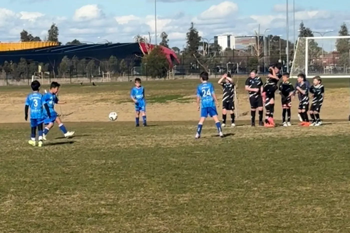 GREAT WALL OF THUNDER: Euroa Under 10s showed fearless determination, putting their bodies on the line as Shepparton United takes a free kick.