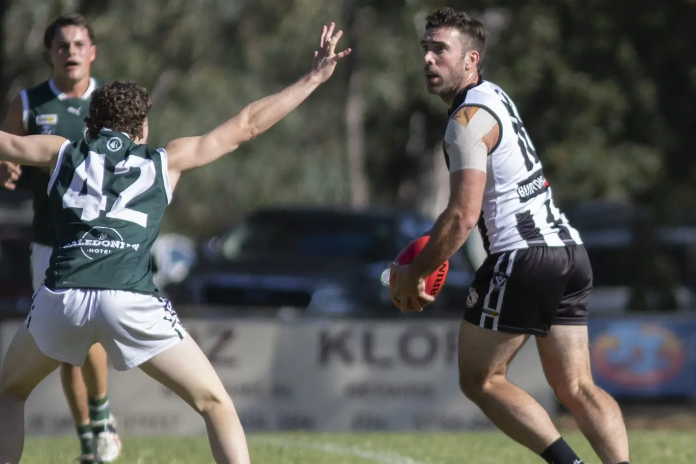 GO LONG: Jack Hellier looks for an upfield target during Euroa\\'s clash with Echuca at the memorial oval on Saturday. PHOTOS: Dale Mann