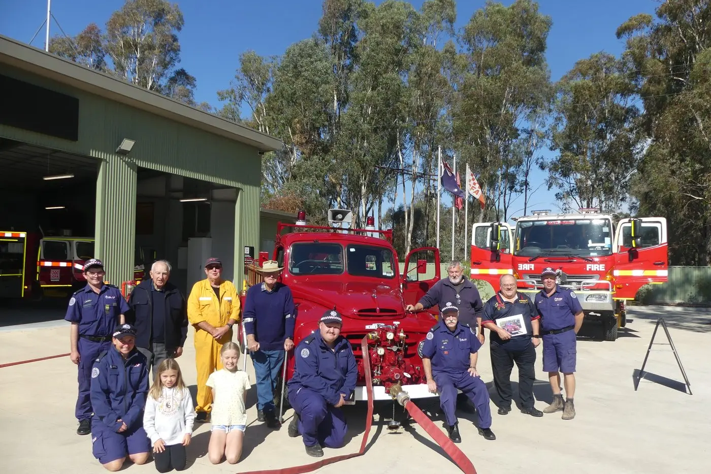 PAST MEETS PRESENT: Admiring the restored 1956 Austin WE 3 series Loadmaster fire pumper truck are CFA Member Kyle Pedder, Vin Palmer, member Neville Forbes, Russell Hurren, member kneeling Matthew Bruce; (front) member Colleen Luff and daughters Emily and Sarah. \\nSeated on fender, Member John Lawler, \\nand on right. Member Des Mason, Eddie Tichelaar and Nagambie Fire Brigade Captain Allen Treble. PHOTOS: Diane Grant    