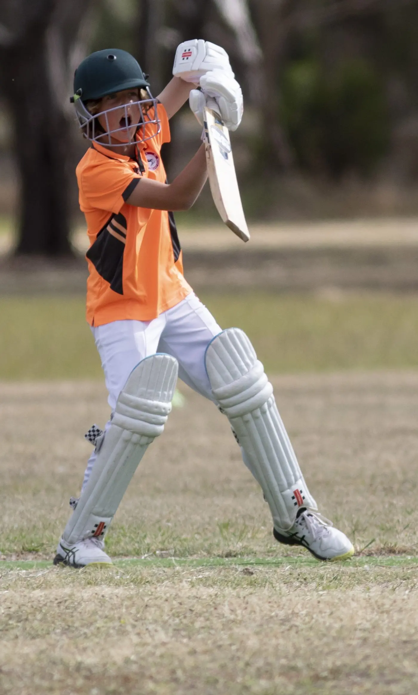 ON THE ATTACK: Henry Williamson takes a swing, looking to make an impact in the Friday night under 12s game. PHOTOS: Dale Mann.