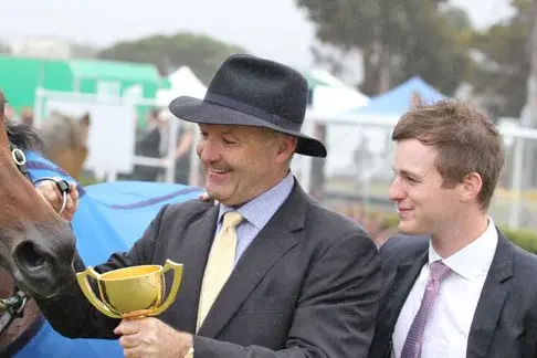 WINNERS: David Hayes and his son Ben with 2015 Geelong cup winner Almoonquith.