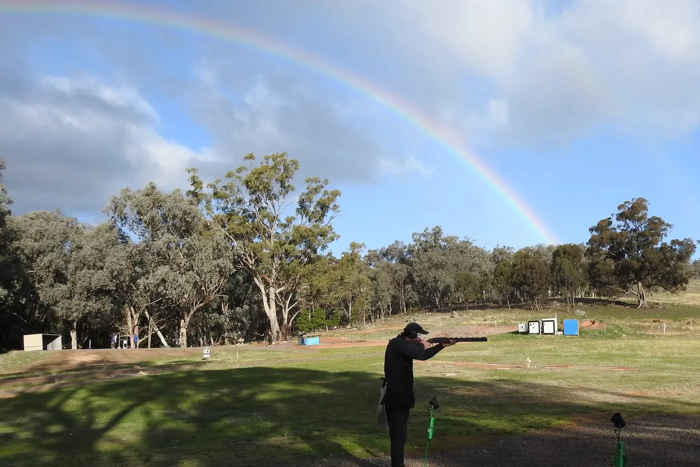 SKIES ARE BLUE: Lloyd Parks, Point score champion, shooting under a beautiful rainbow.