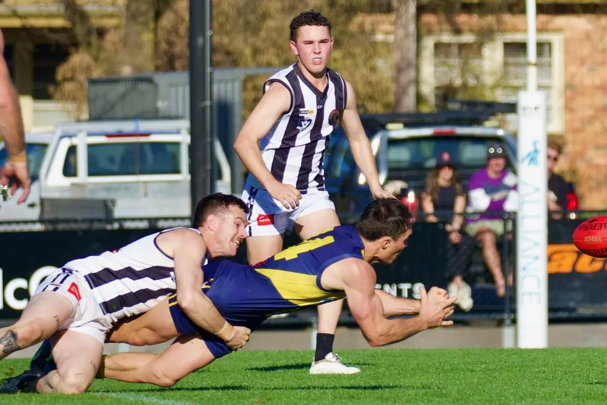 BIG TACKLE: Jayden Gleeson tackles a Mansfielder as Keily Jager looks to recover the ball. PHOTOS: Paul Martin