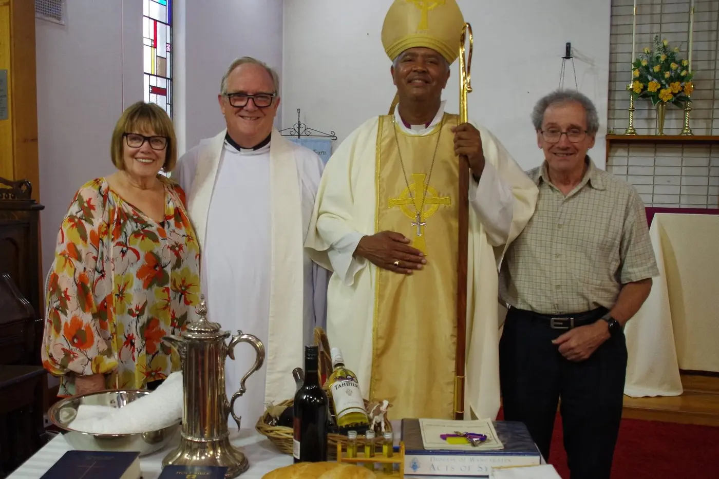 HOLLY MOLLY: Standing in front of the symbols of ministry table at the induction service are Jen and Reverend Richard Pennington, The Right Reverend, Clarence E Bester, Anglican Bishop of the Diocese of Wangaratta, and church warden from Christ Church Ernie Lewin.  Id:19779