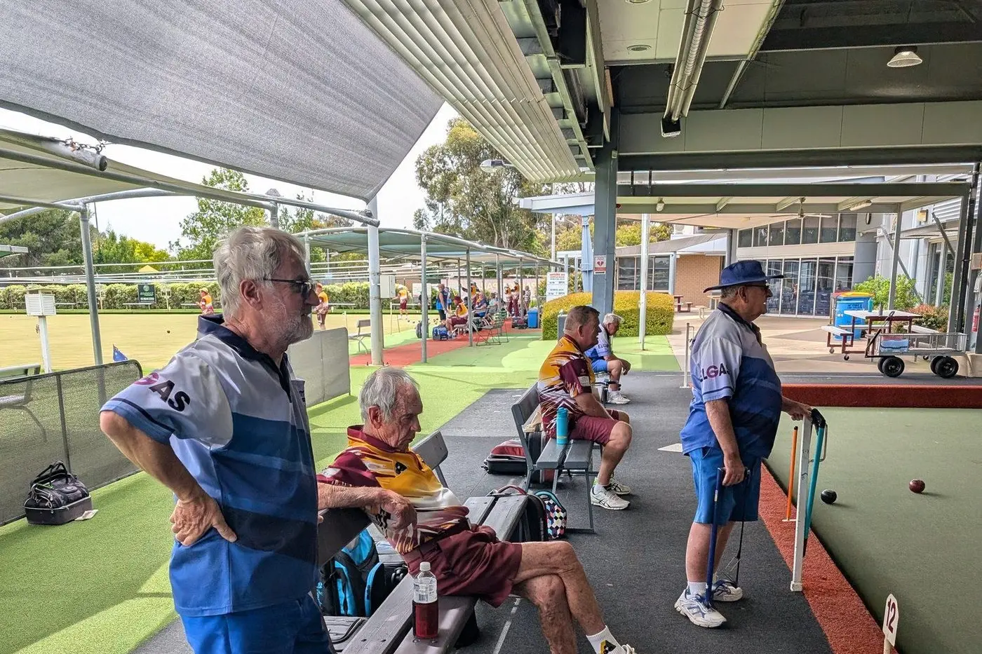 UNDERCOVER PLAY: Euroa team stays dry and continues play under cover despite the rain.
