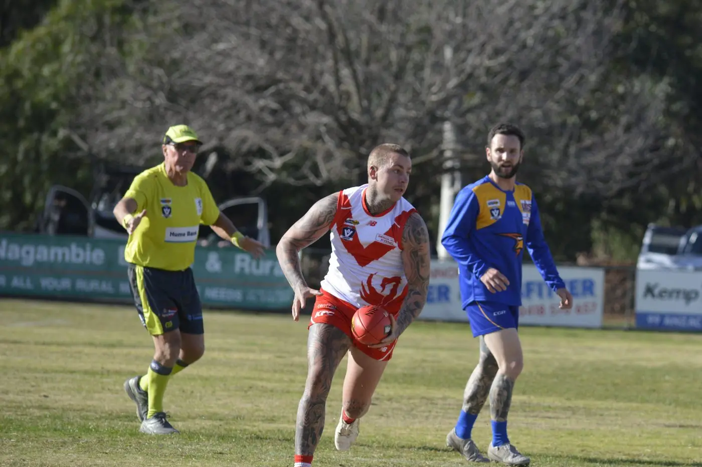 FULL ATTACK: Zac Hill pulls away from his Shepparton East opponent.