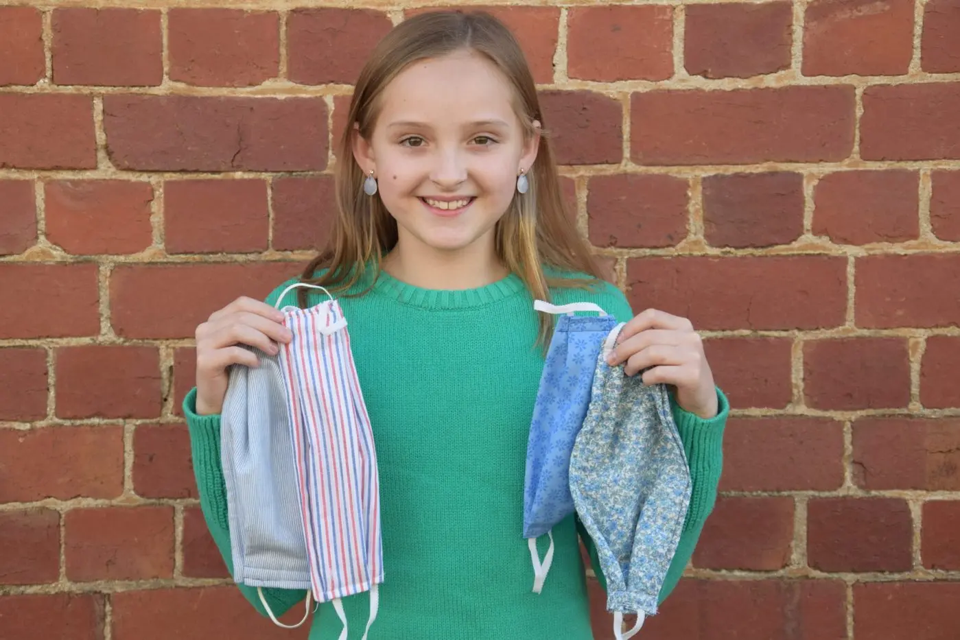 MASKS APLENTY: Violet Town\\u2019s Elliette Jeffrey with an array of masks that she has made over the recent days. All proceeds from the sales of her masks will go to organisations working towards a vaccine for COVID-19. PHOTO: Philippe Perez