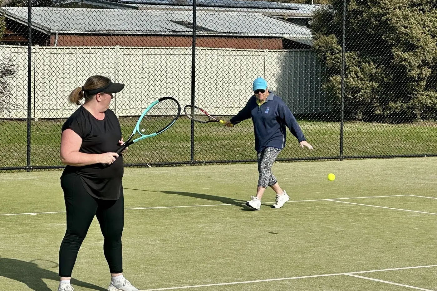 DOUBLES ACTION: Jo and Karyn locked in close match.