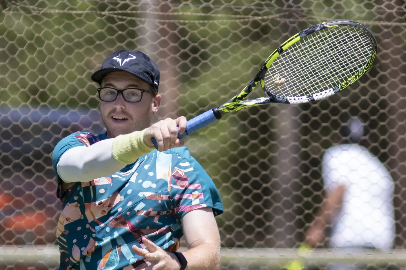 RED ALERT: Bede Redfern unleashes his powerful forehand, bringing the heat. PHOTOS: Dale Mann