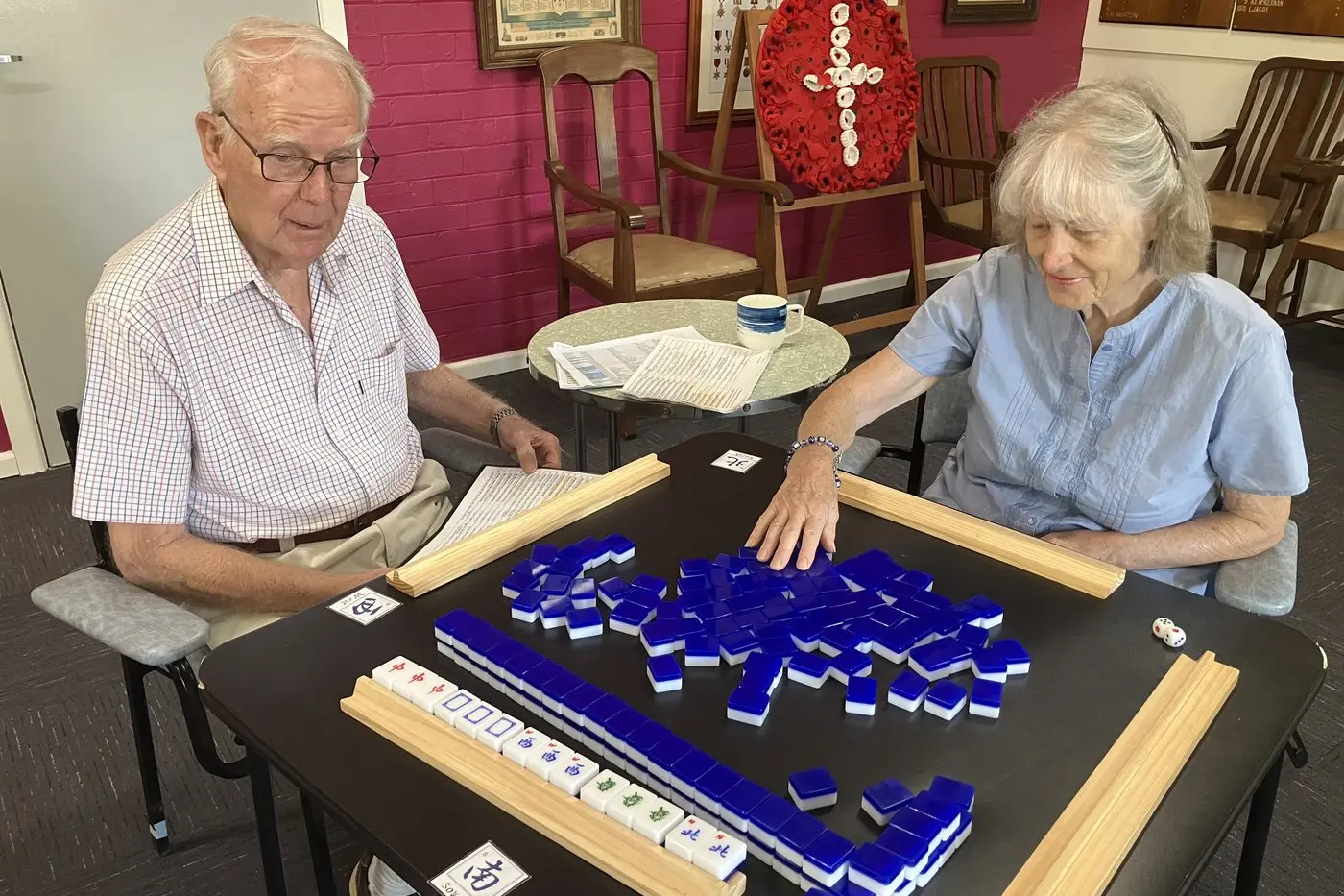 GAME PLANS GALORE: Bob Holloway and Barb Hayden vie for the upper hand in Mahjong.