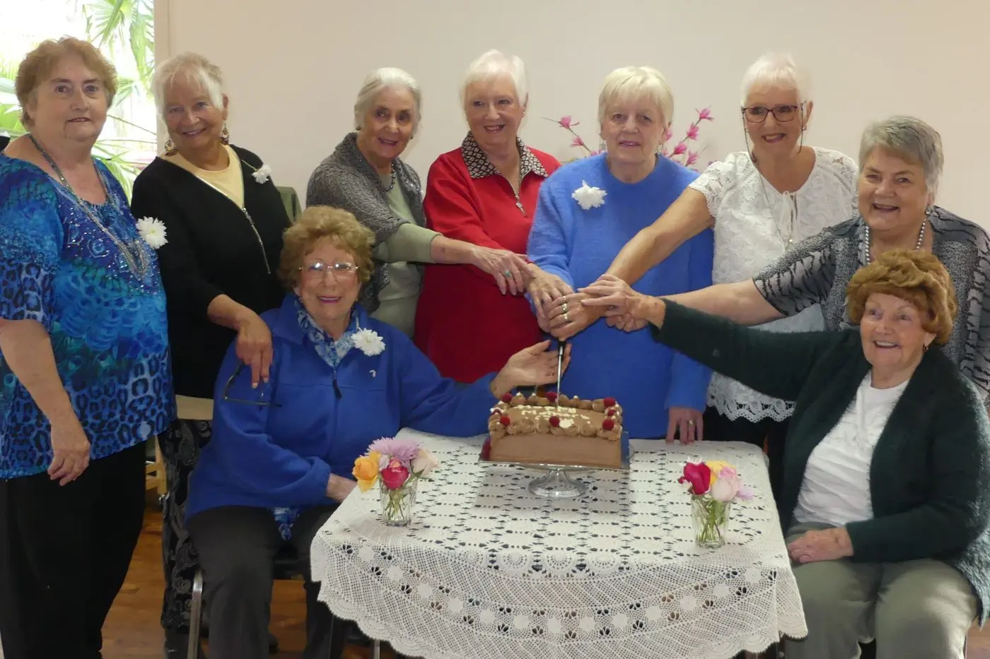 CELEBRATING MOTHER\\'S DAY: Celebrating Mother\\'s Day cutting a special cake at their afternoon tea dance are these long\\u2013term Kelvin Grove Village ladies, with event organiser Diane Grant far left. Then Kay Hoefs, Sonia Aspinall, Sue Gray, Jessie Worthington, Robyn Spinner and Glenis Hageman. Seated are Margaret Marks and Margaret Rea. PHOTO: Stephanie Laverie Id:41660