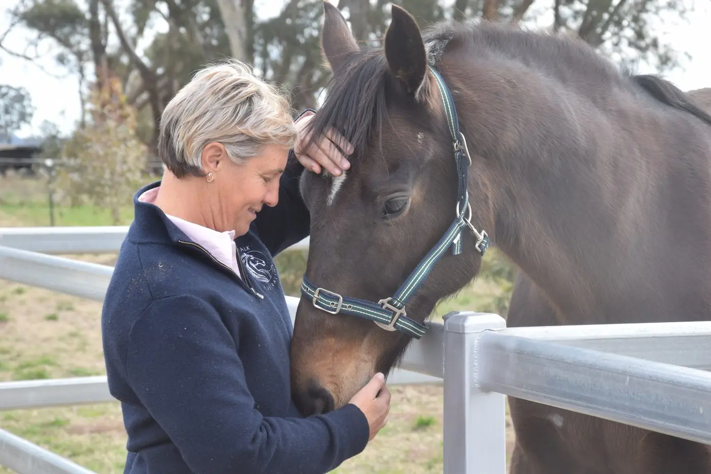HEALING WITH HORSES: Former Euroa Police sergeant Robyn Reed has retrained to take up work as an equine-assisted psychotherapist. She is pictured with Ozzie at her property in Violet Town. PHOTO: Darren Chaitman
