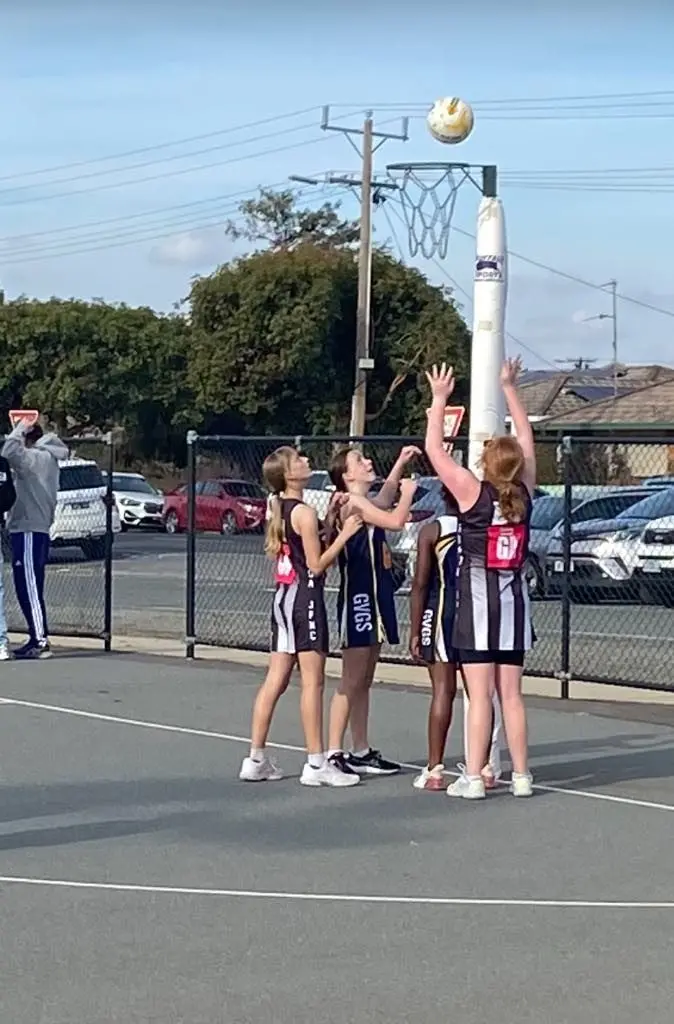 FULL SUPPORT: Chloe shoots for goal with Jess providing back up.