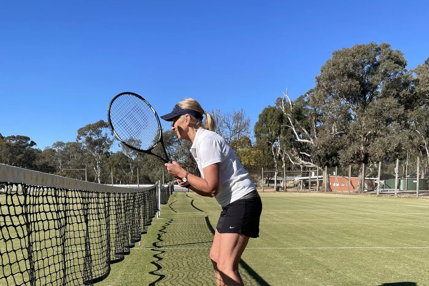 CRITICAL POINT: Carol stays focused at the net during the final set.