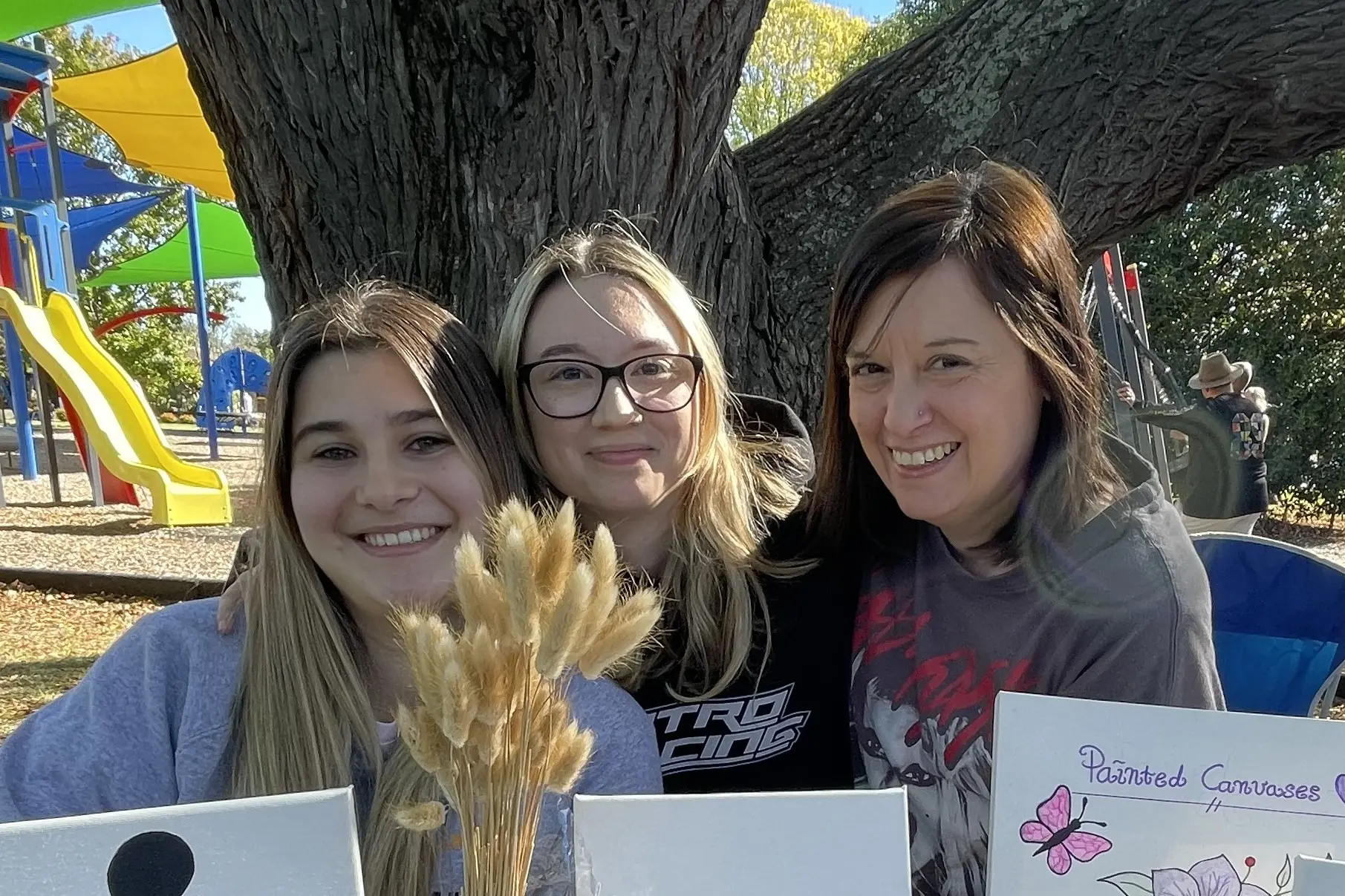 <p>TATTOOISTS START SOMEWHERE: Bianca Caruso, centre, with friend Kiara Dafovski and mum Daniella at the Avenel markets. PHOTO: Andy Wilson</p>\\n