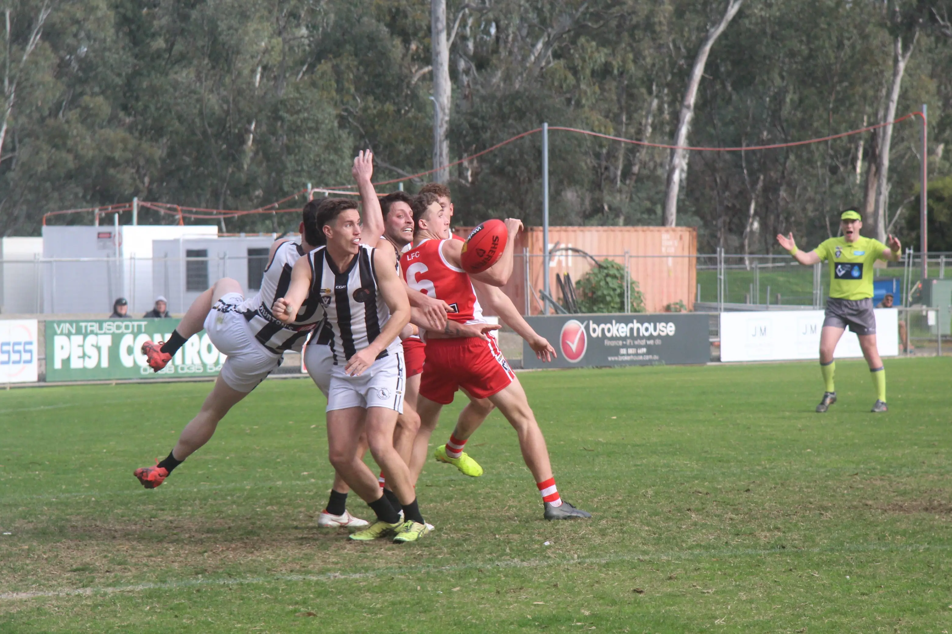 <p>GOAL SQUARE SCRAMBLE: Nic Asquith and Magpies players clash in a fierce contest close to goal.</p>\\n