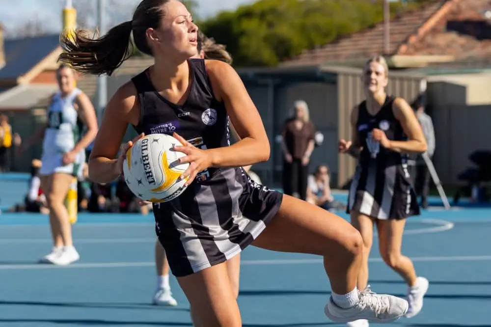 <p>MOMENTARILY OFF BALANCE: Taiysha Wallis fights to keep her footing. The versatile Wing Attack worked tirelessly in the midcourt. PHOTO: Matthew Mills</p>\\n